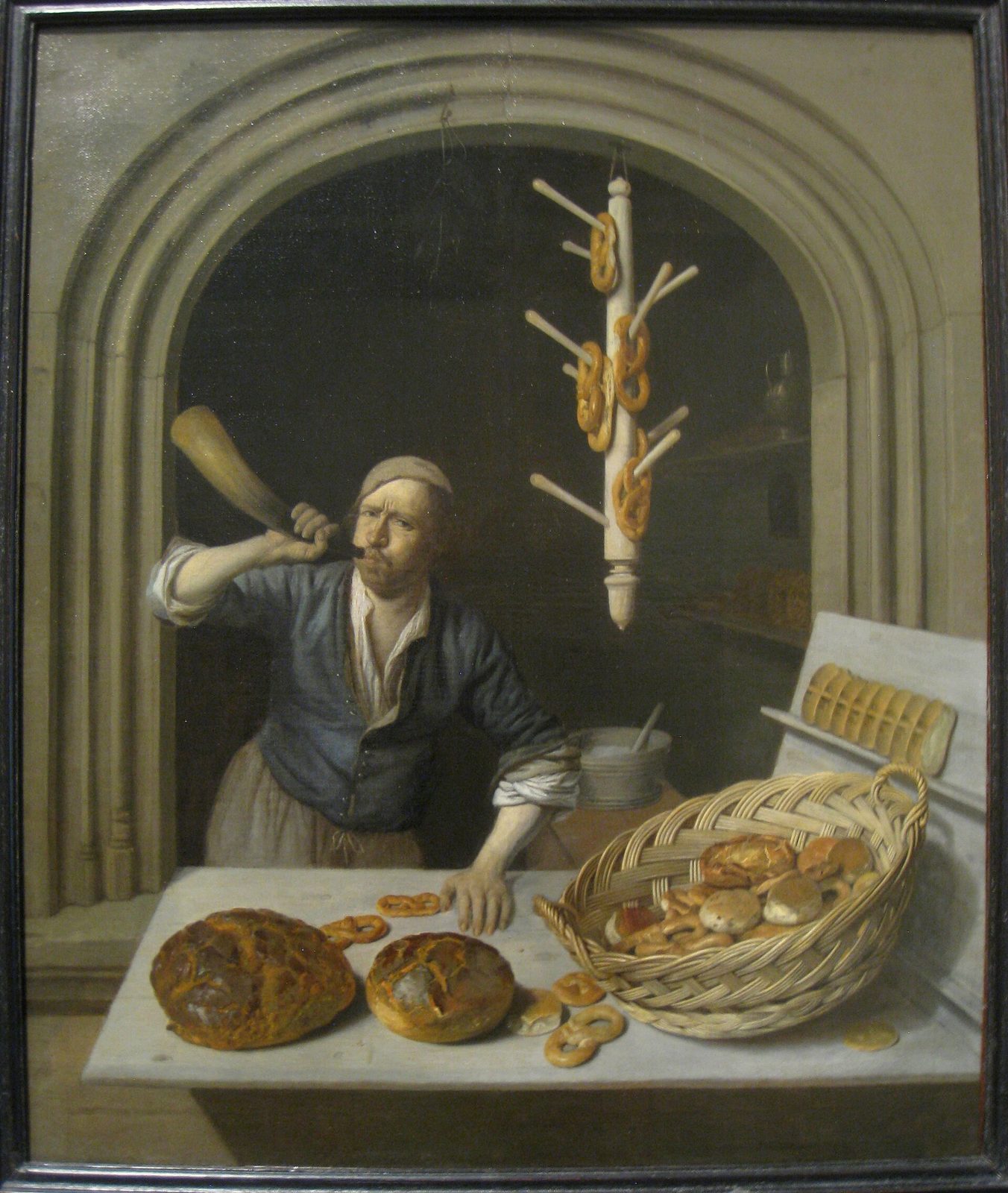 Job Berckheyde's painting The Baker, circa 1681 — a baker sounding his horn over fresh loaves and rings