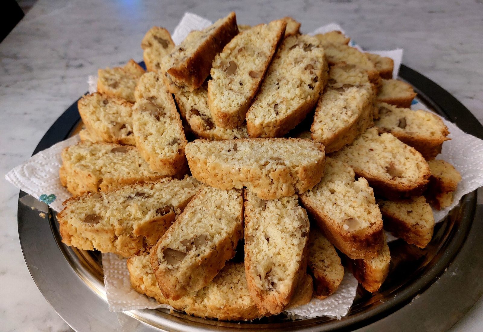 A pile of cantuccini di Prato, cut faces showing whole almonds